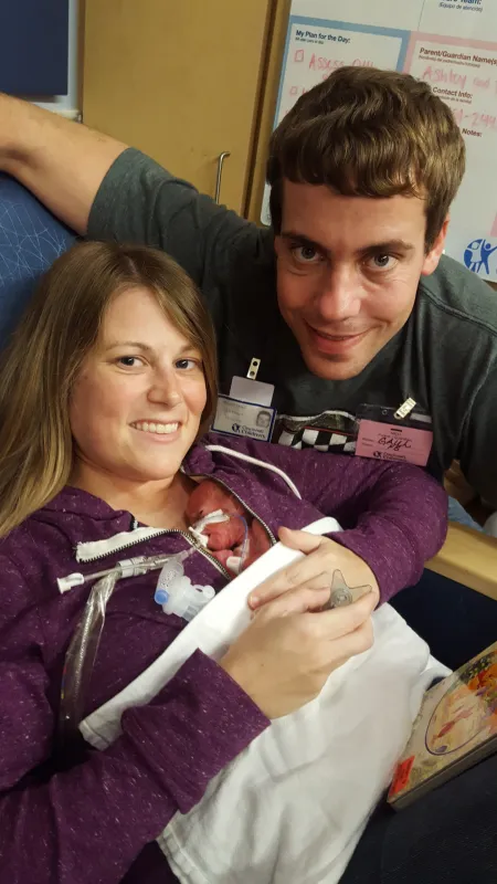 Kid Captain Eliana Gaul as a premature infant being held by her parents