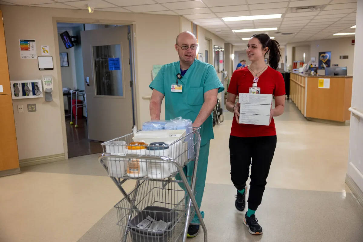 Lana Cichosz, PCT and Steve Hoff, NA collaborate in the University of Iowa Hospitals and Clinics Burn Treatment Center.