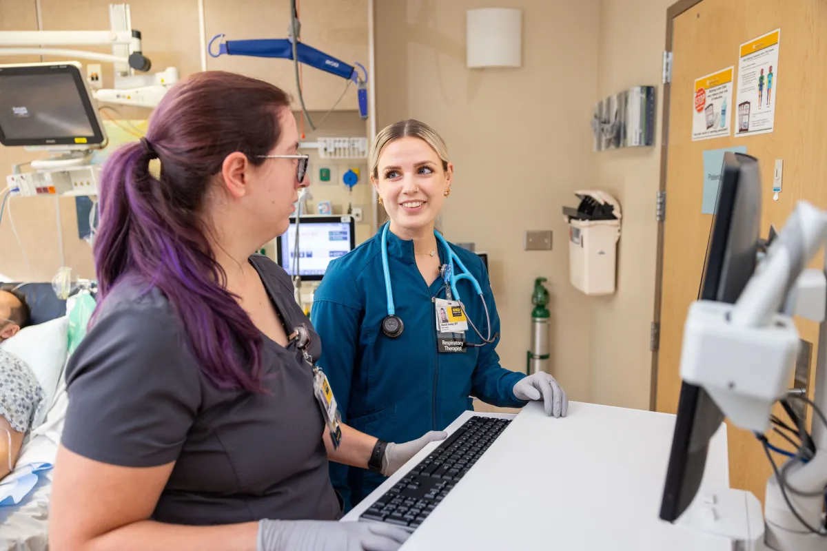 Respiratory therapists Chris Harrison and Hannah Sondag and nurse Brianna Pickel in the CVICU on the UI Health Care university campus on Friday, Nov. 8, 2024. Simulated patient is an employee.