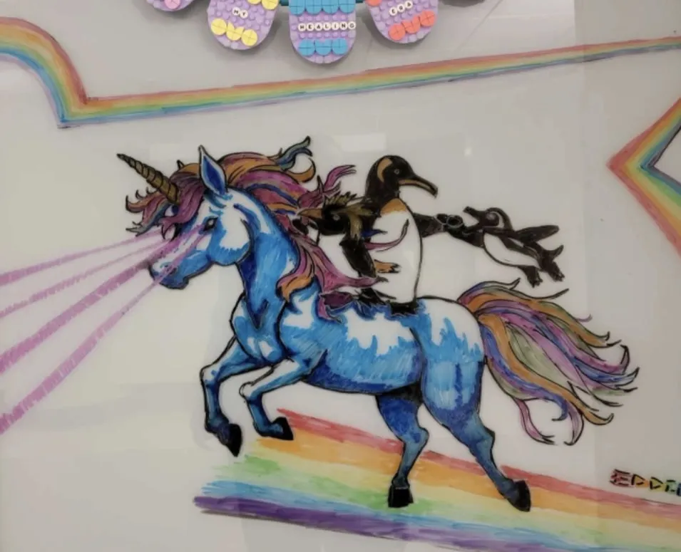 A pediatric patient’s love of unicorns, rainbows, and penguins inspired Hatcher to combine all three into one drawing. 