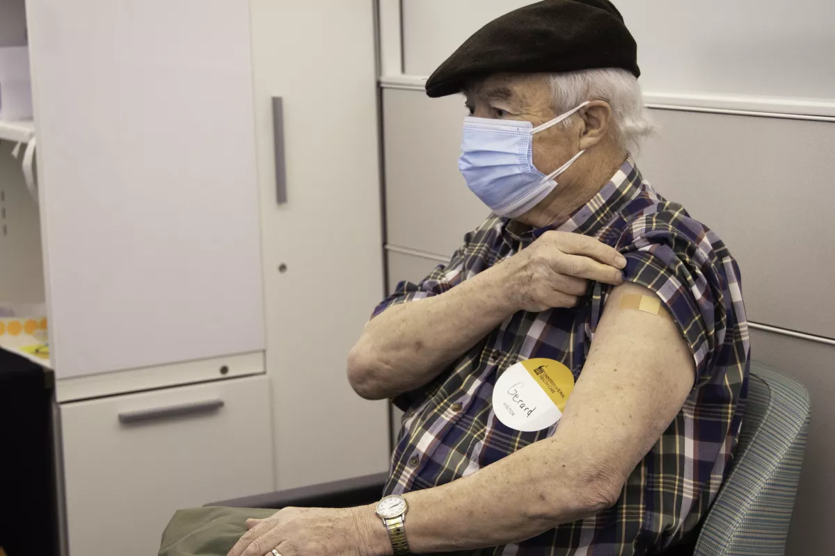 Gerard Rushton receives his first dose of a COVID-19 vaccine on Wednesday, Feb. 3, 2021.
