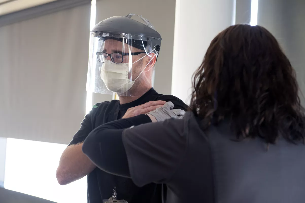 Employee receiving the Pfizer-BioNTech vaccine at UI Hospitals & Clinics