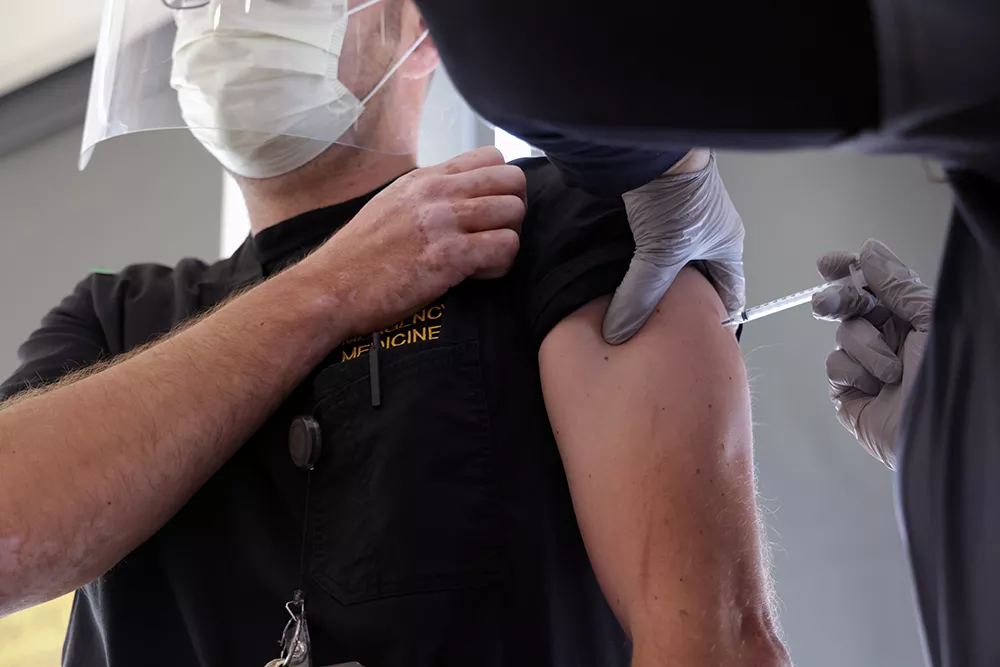 Employee receiving the Pfizer-BioNTech Vaccine (Comirnaty) at UI Hospitals & Clinics