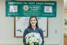 Laura Manuel,  BSN, RN, CCR receiving her DAISY Award