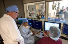 UI Heart and Vascular Center electrophysiologists (from left) James Hopson, MD, Paari Dominic, MBBS, MPH, and David Hamon, MD, review a case in the cardiac catheterization lab.