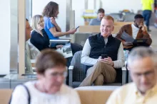 Staged patients sit and wait in the NL campus waiting area
