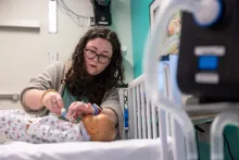 Andrea Arens checks trach on simulated child during training