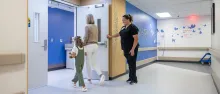 Staff nurse Sydne Oszfolk, RN BSN, greets a simulated pediatric patient in the dedicated pediatric waiting room at UI Health Care Pediatric Emergency Department at the university medical center on Wednesday, Aug. 13, 2025. Simulated patients with consent forms on file. 