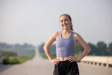 Grace Lidgett runs through rural Tama County on Thursday, July 31, 2025. Grace was diagnosed with cystic fibrosis as an infant, and through therapies that included Ofkambi and now Trikafta, has been able to live an active life that included running on her high school track and cross country teams.