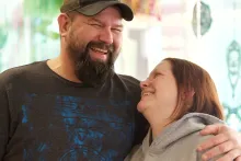 Husband and wife laughing together