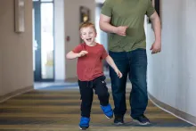 Sawyer Conrad, 5, plays with his parents Rachel and Hubert Conrad at UI Health Care Stead Family Children’s Hospital on Wednesday, March 18, 2026. Sawyer is seen through the multi specialty spasticity clinic for children, and was treated through a selective dorsal rhizotomy (SDR).