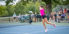 Mackenzie Sagers, 17, leaping to hit a backhand during a tennis match