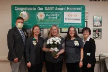 Crystal Christensen (center) BSN, RN, CCRN, celebrates her DAISY Award with other members of the nursing team.