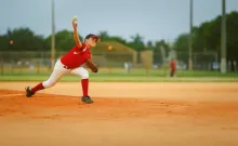 Stock photo of youth baseball pitcher