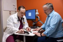 Dr. Peter Farjo with simulated patient (employee) in the Heart and Vascular Center on Wednesday, April 24, 2024.