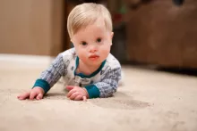 Rohen Carberry laying on carpet floor