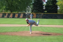 Egan Smith throws a pitch during a baseball game