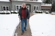 Alan Leff in front of his University Heights home