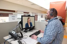 Photo of a patient and provider participating in a telemedicine appointment