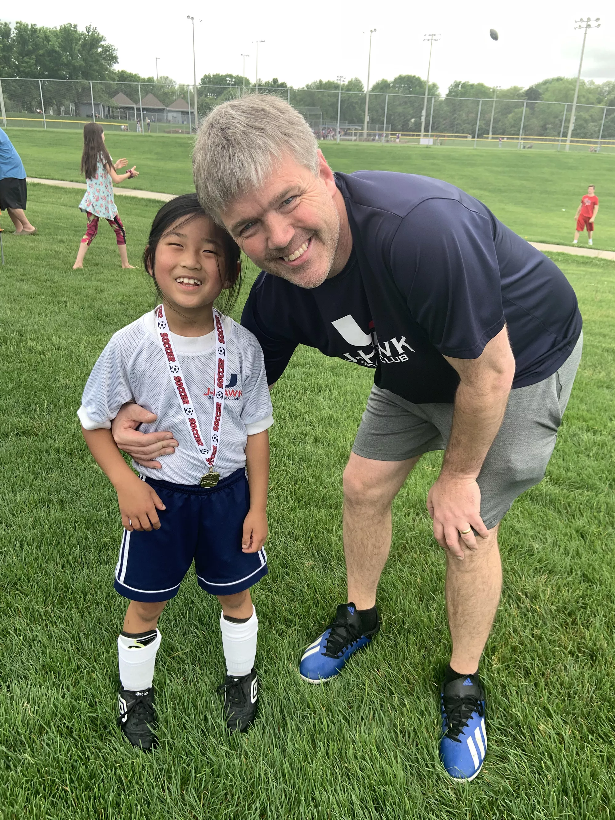 CC and her father at a soccer field