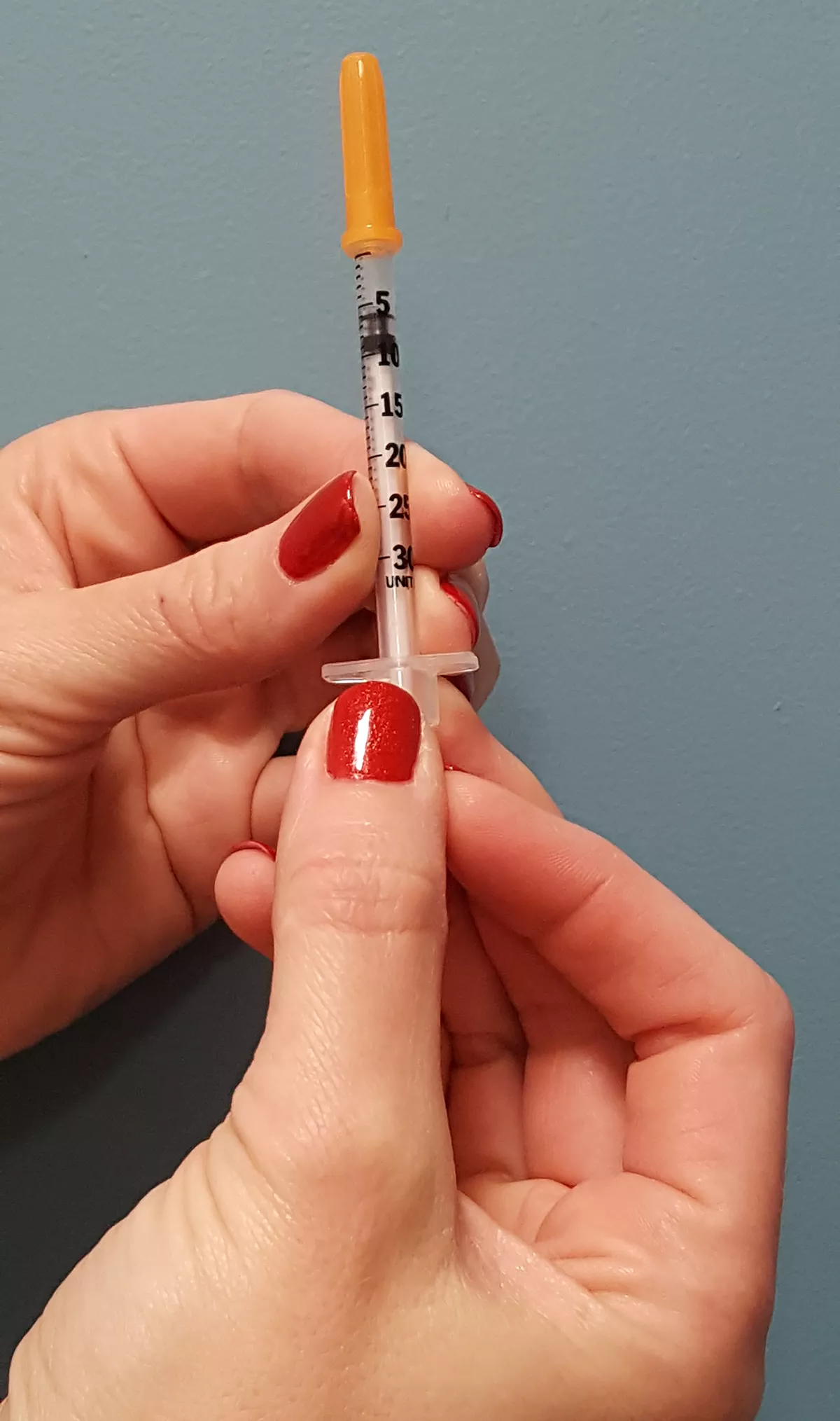 insulin drawing are into syringe, photo