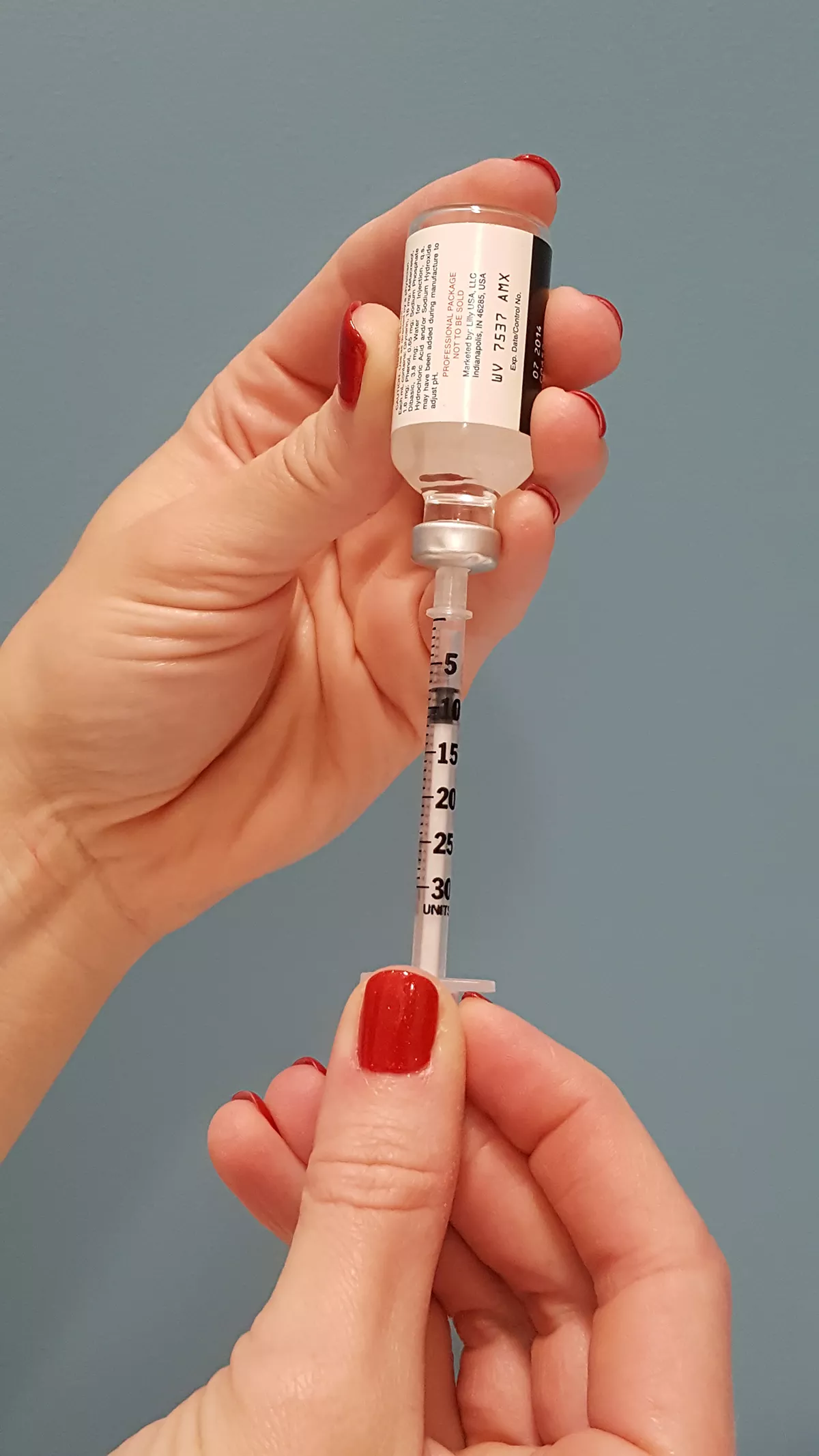 insulin drawing insulin into syringe, photo