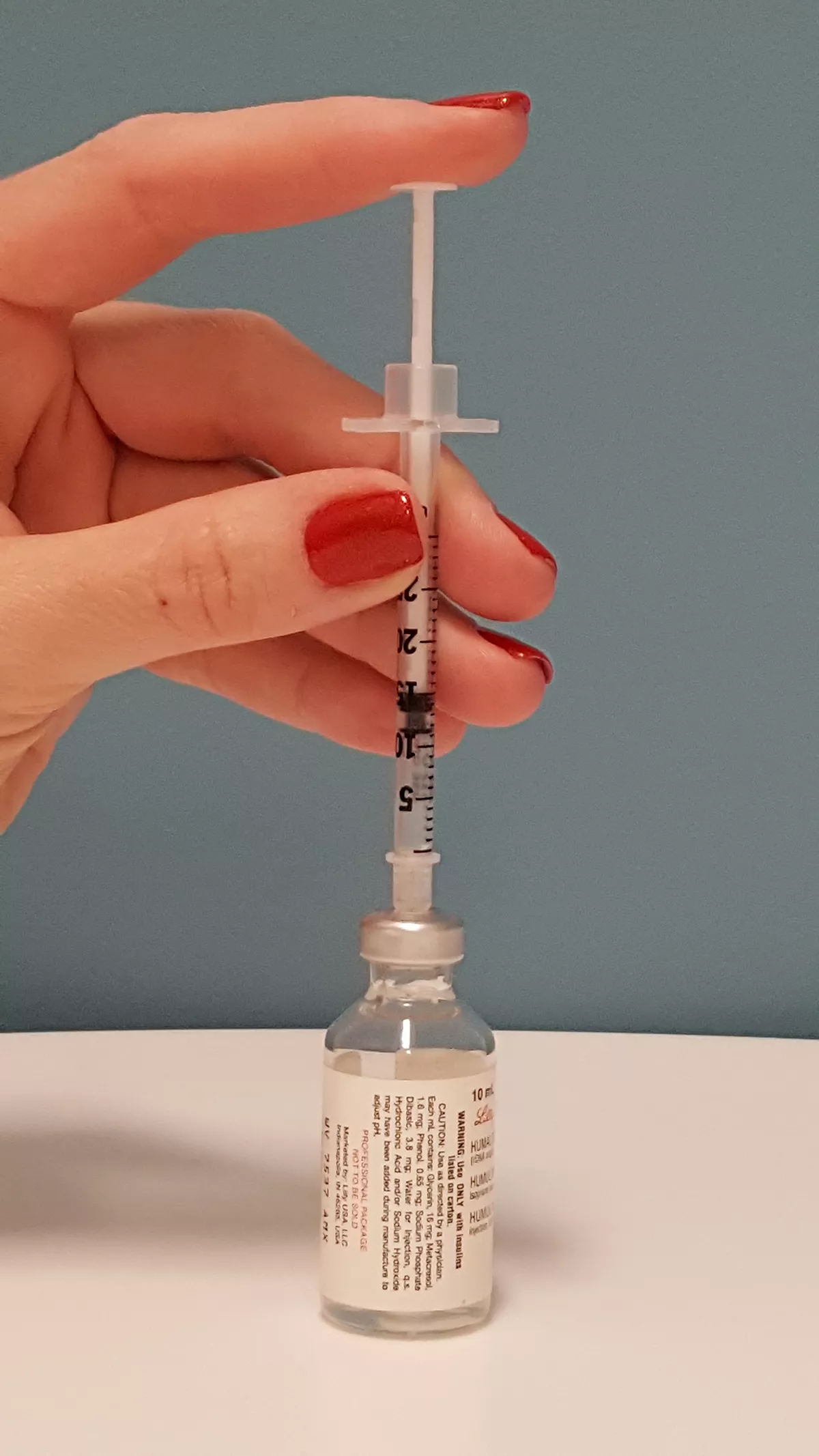 insulin injecting air into vial, photo