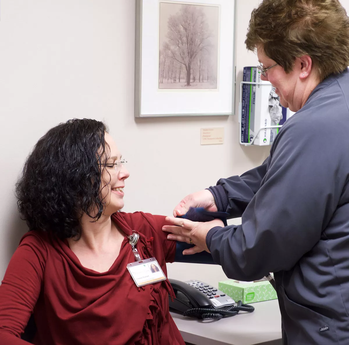 Nurse taking a patient's blood pressure. 