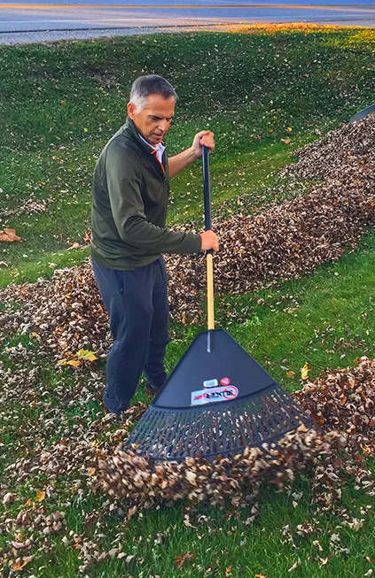 Howard Dittrich raking leaves