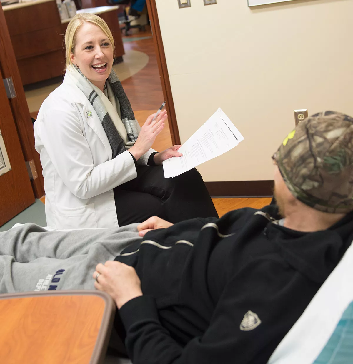 Pharmacist assisting a hospitalized patient