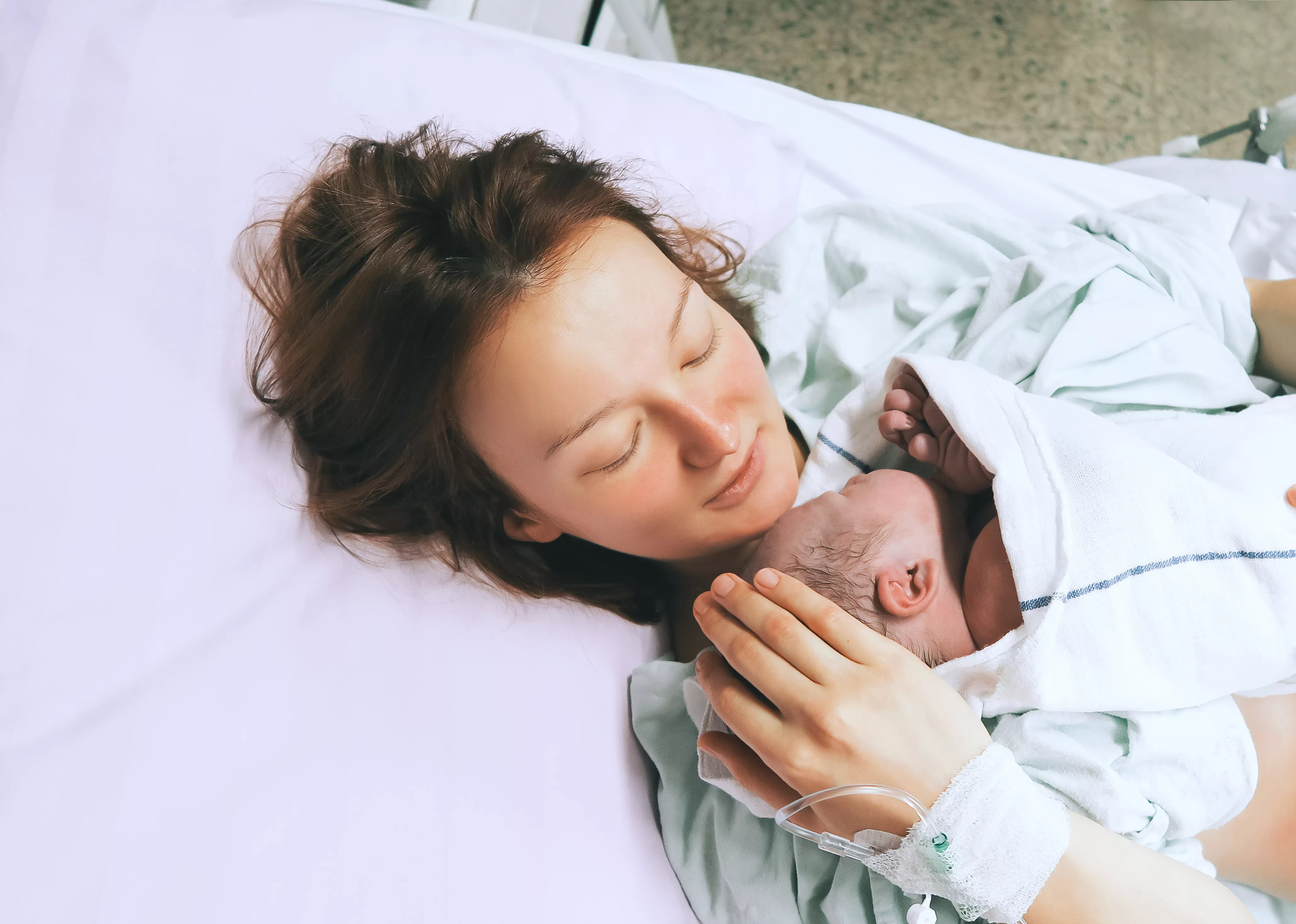 Mother and newborn rest together after labor