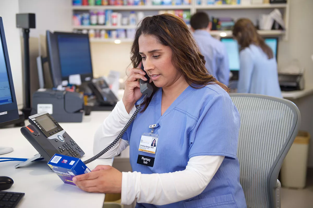 Pharmacy specialist on the telephone