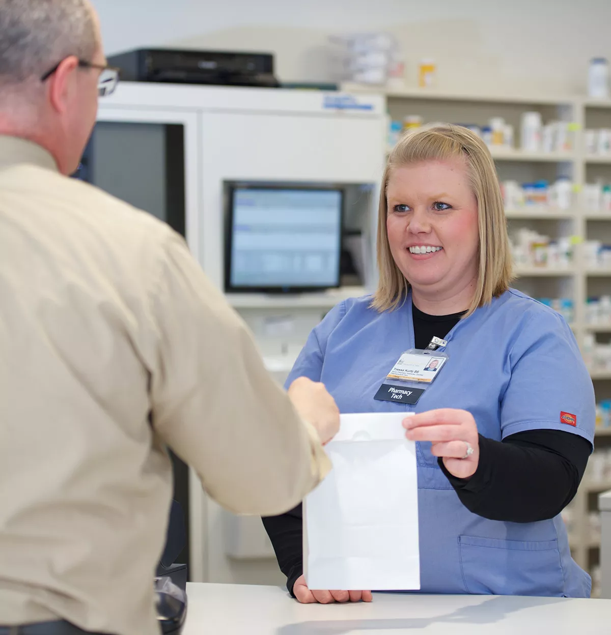 Pharmacy Tech at counter